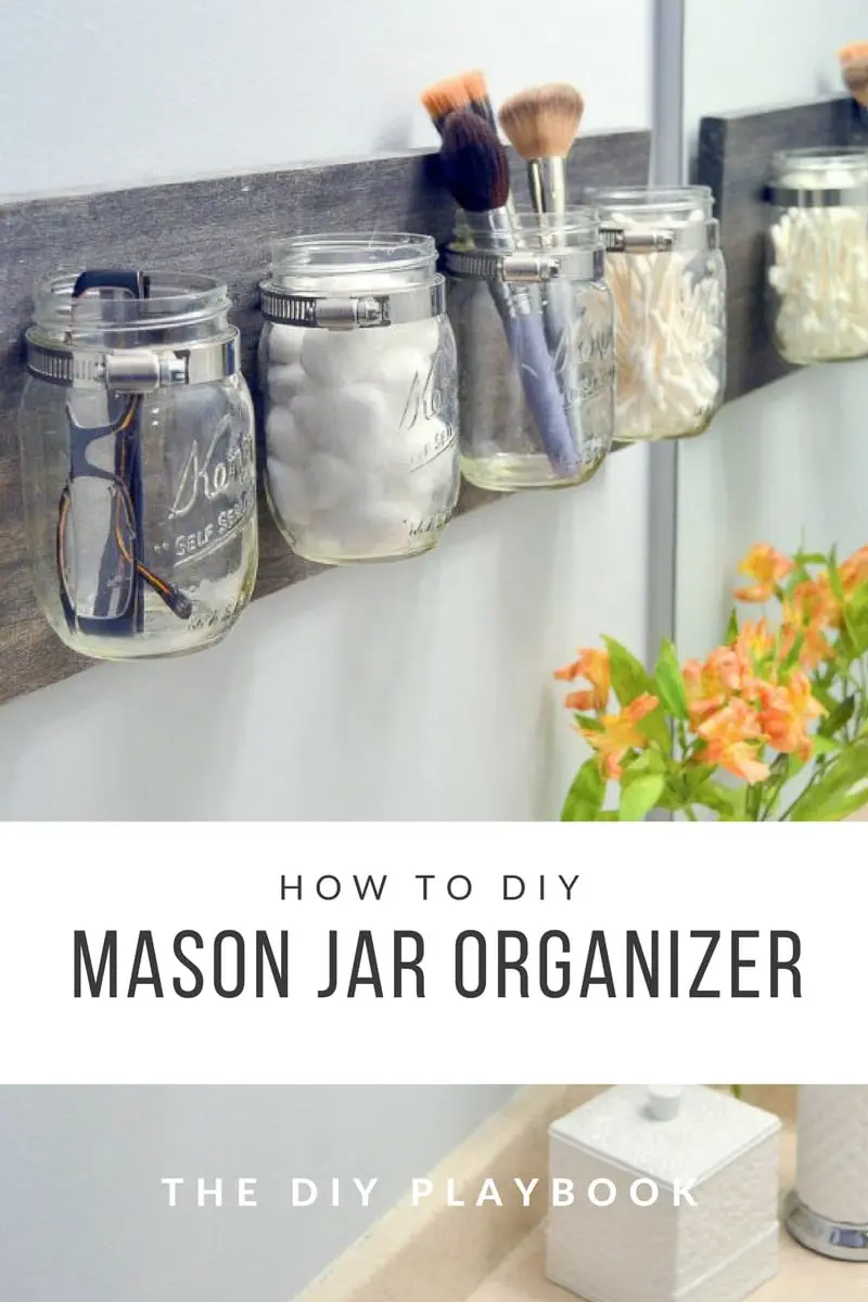 mazon jars attached to a wood plank to be used as bathroom accessories orgabizers