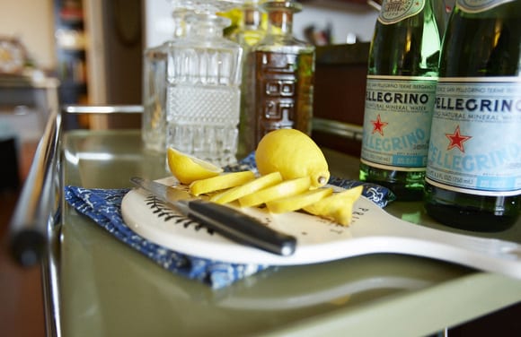 These cut lemons on this chic cutting board look great on the bar cart. 