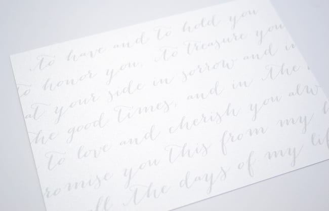 cursive vows on the back of Casey and Finn's wedding invitations