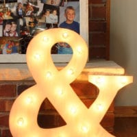 This light up ampersand at the bridal shower is a cute decor piece.