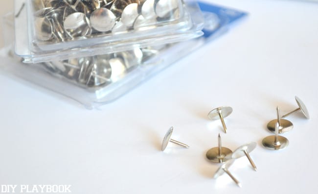 The thumb tacks I used for my  DIY Thumb Tack Art look like nail heads - I love that look. | DIY Playbook