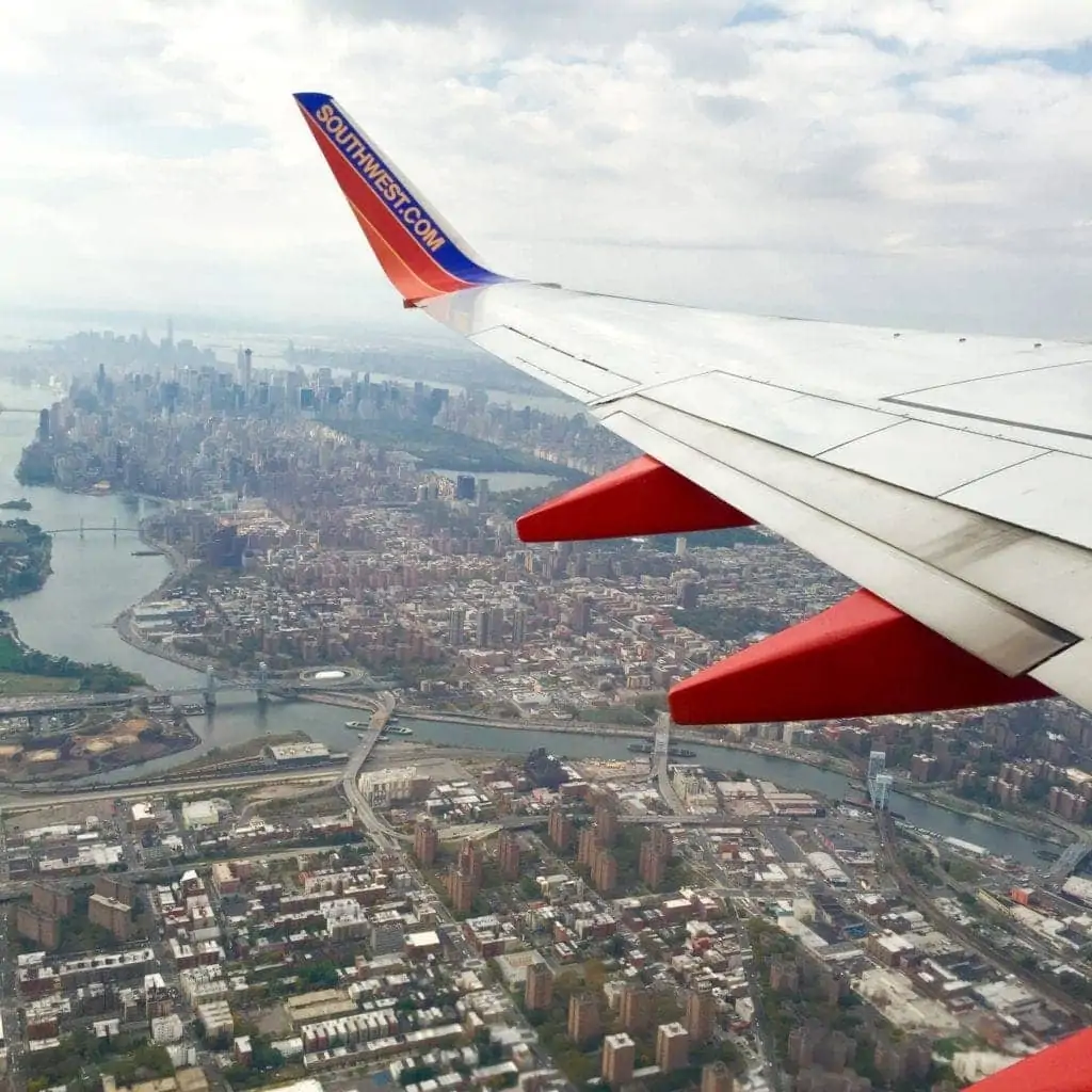 Casey and Bridget fly away from NYC in a Southwest plane. 