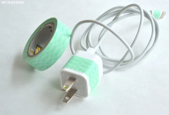 Adding washi tape to your phone charger makes it look cute and ensures you won't forget it!
