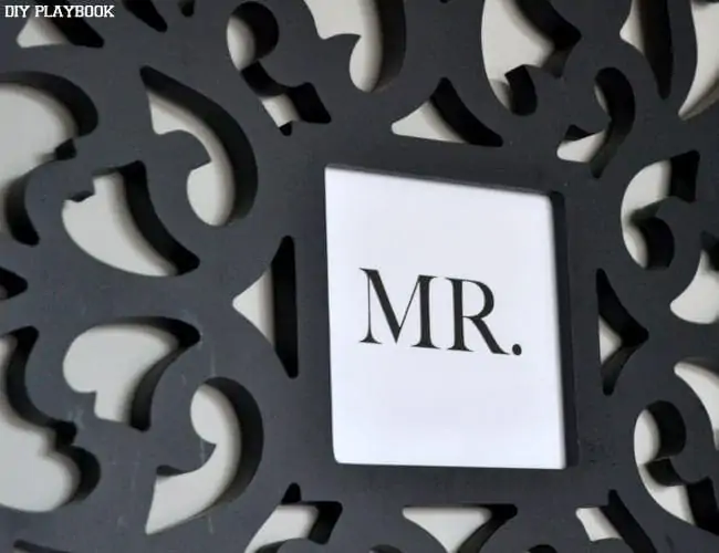 This Mr. Sign adds a masculine element to the room's design. 