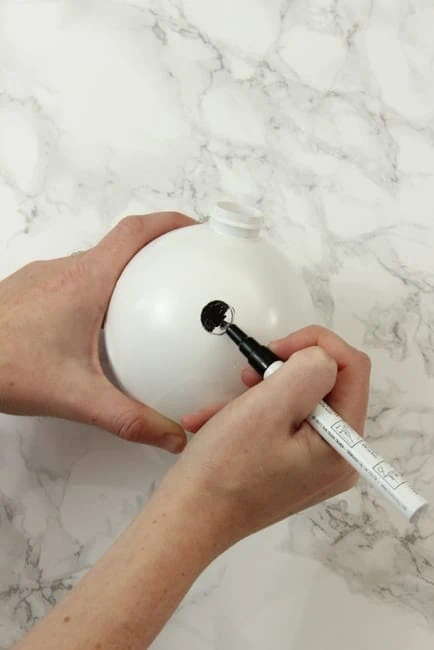 white ornament paint marker: DIY Kate Space Ornaments | DIY Playbook