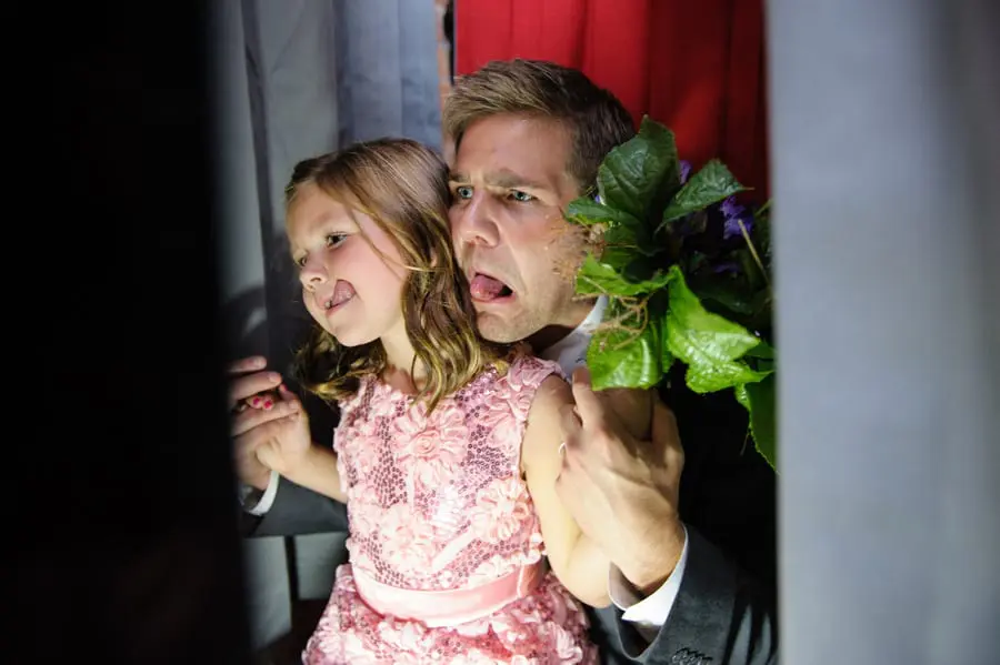 A photo booth is a fun wedding reception activity for kiddos.