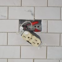 Be careful with outlets when installing new kitchen backsplash.