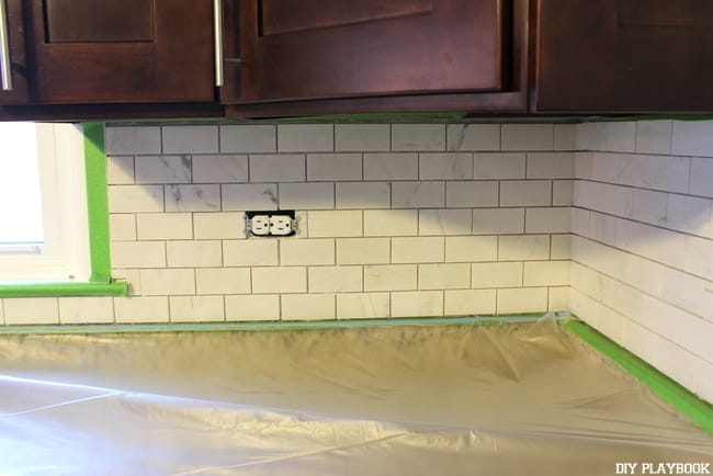 Grout is messy, be sure to use plastic cover AND tape