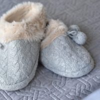 These fuzzy gray slippers are super soft.