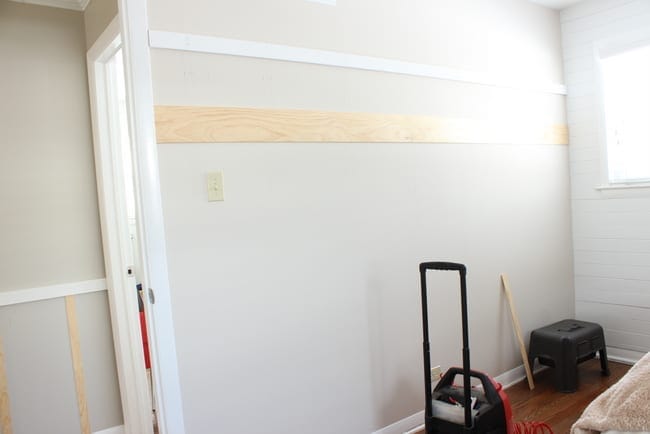 Board and batten bedroom DIY tutorial step one. Add your horizontal board. You can also see what we did in the hallway in the photo on the left.