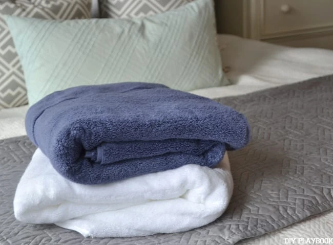 Blue-White-Towels-on-Bed