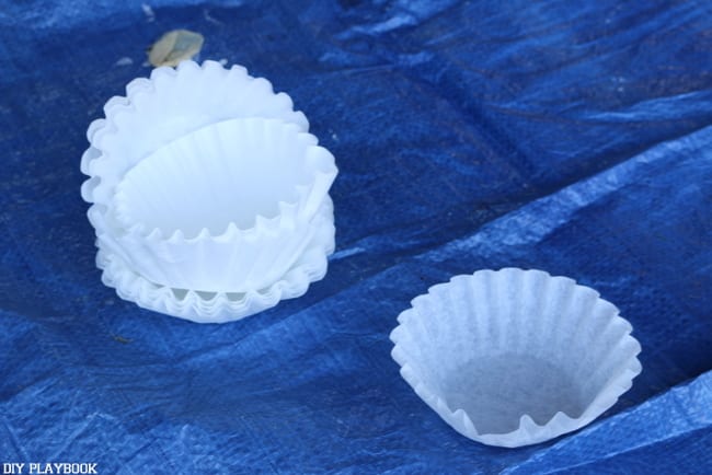 Assemble coffee filters to use for the DIY flower boxes. 