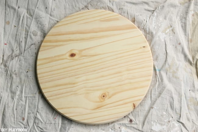 Round wooden base for the plant stand. 