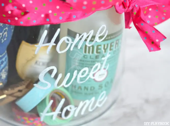 The glass canister can be filled with your favorite housewarming supplies - everything from cleaning products to champaign!