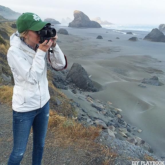Casey stops to take a picture along the coastline of Highway 101! If you're planning a Seattle to San Francisco Road Trip, the beautiful coastline views are a must-see!