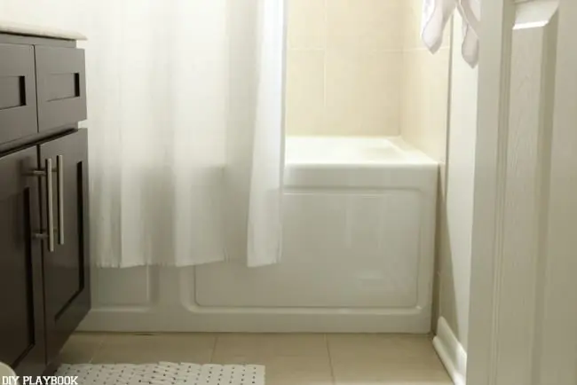  This is NOT the right height for your shower curtain. It should reach the floor!