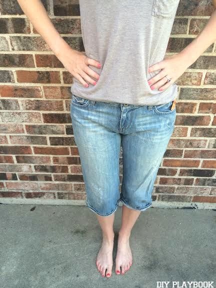 Start with a pair of jeans you're ready to part with for your DIY jean shorts.