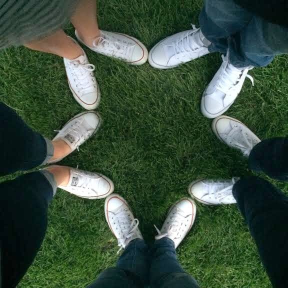 Matching white Converse shoes with your family is a cute way to have fun. 