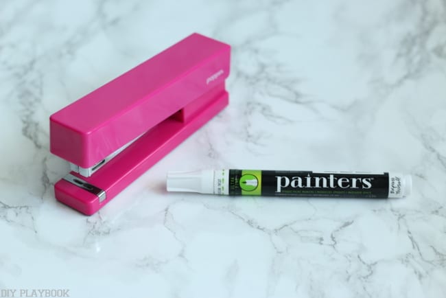 Use a paint pen to customize a plain colored stapler