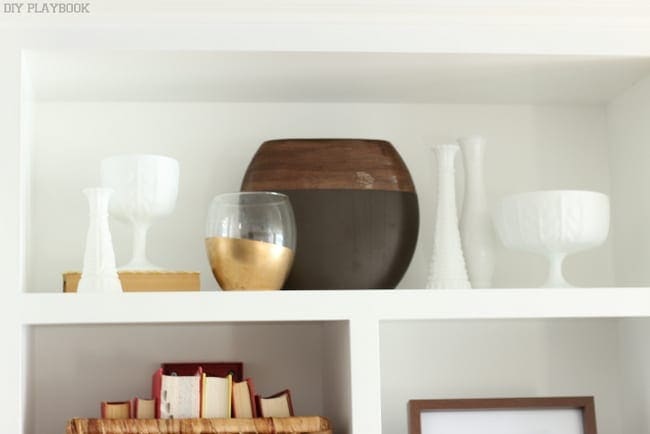 Bookshelf design details; decorative bowls and vases.
