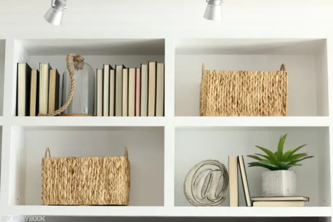 Built-in bookshelf design and decorated with home accessories. 