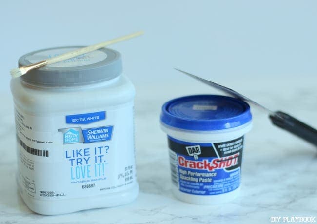 How to fix nail holes in your walls: To start, you need these materials; some paint and spackling paste.