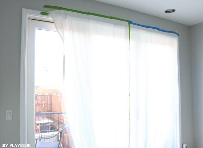 curtain with tape on windows progress