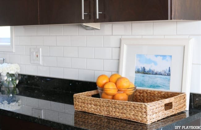 I'm loving the look of our new white subway tile backsplash under our kitchen cabinets. 