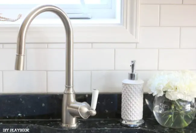 Love how the White Subway Tile Backsplash looks with our kitchen faucet. 