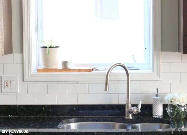 Doesn't it just look like a whole new sink with the white tile backsplash? 