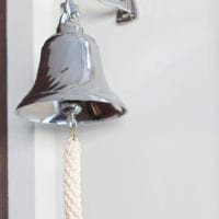 This silver kitchen bell adds a rustic element to the space.
