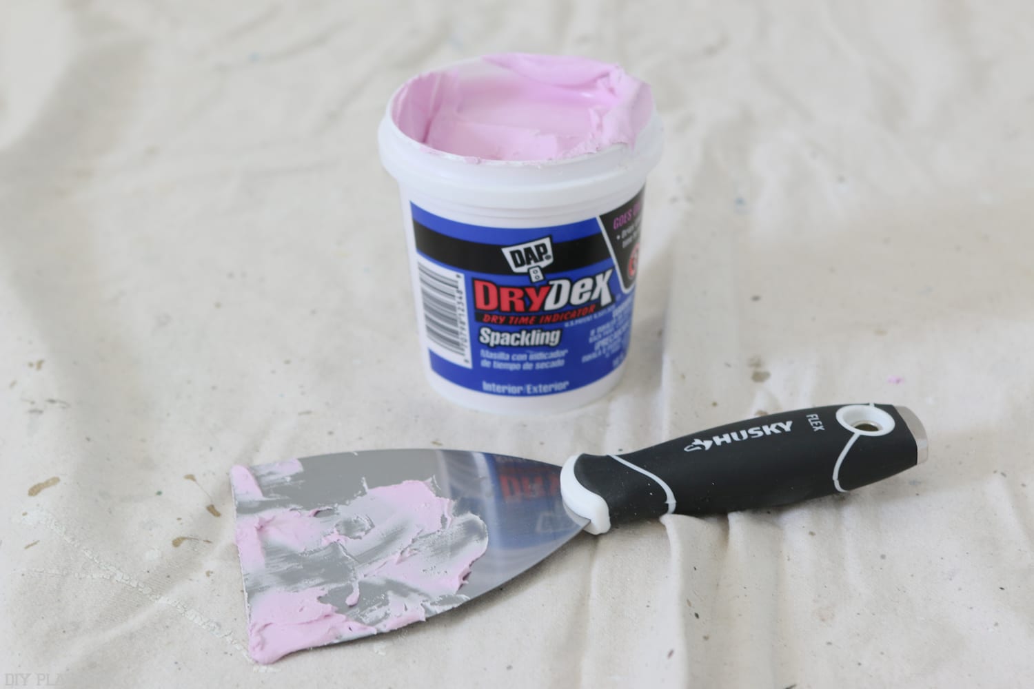 We used bright pink spackle to cover any imperfections and holes in the walls.