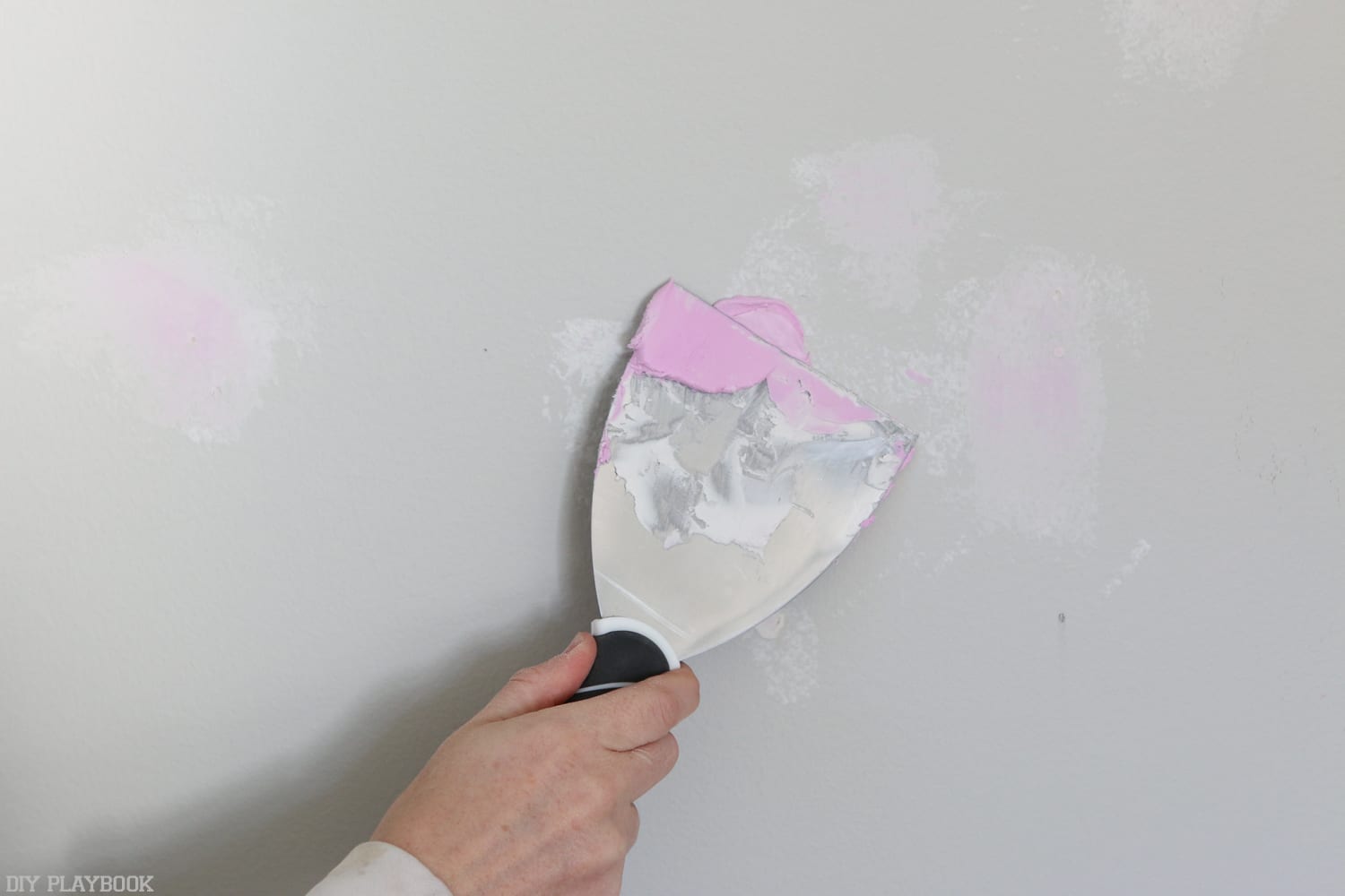 The bright pink spackle dried the same color as the regular spackle! How fun is that?