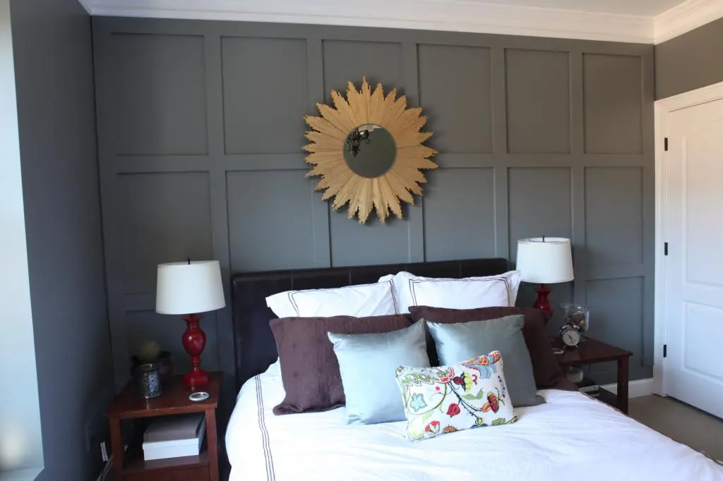 This accent wood wall behind the bed adds dimension to the room. 