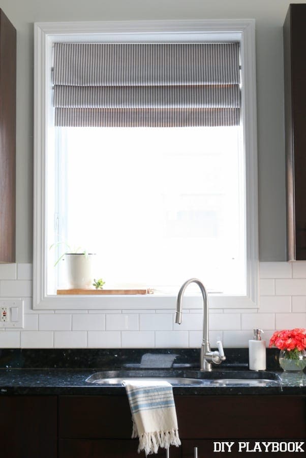 this gorgeous window brings a lot of light into the kitchen