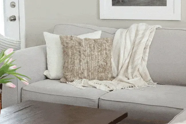 Fun pillows are also the perfect way to hide the imperfect parts of your couch