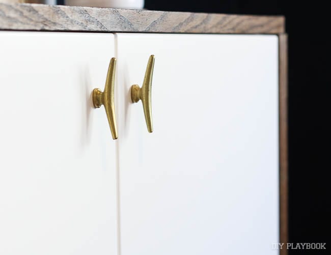 Gold knobs from Anthropologie look amazing on the credenza!