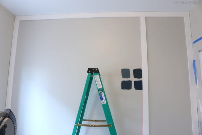 Vertical board installation on the guest room wall makeover. 