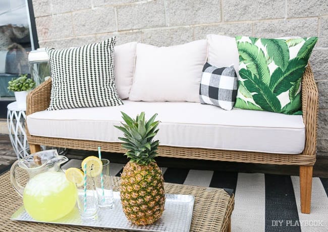Our new couch - part of our new patio decor from Wayfair. Check out all those fun throw pillow patterns!
