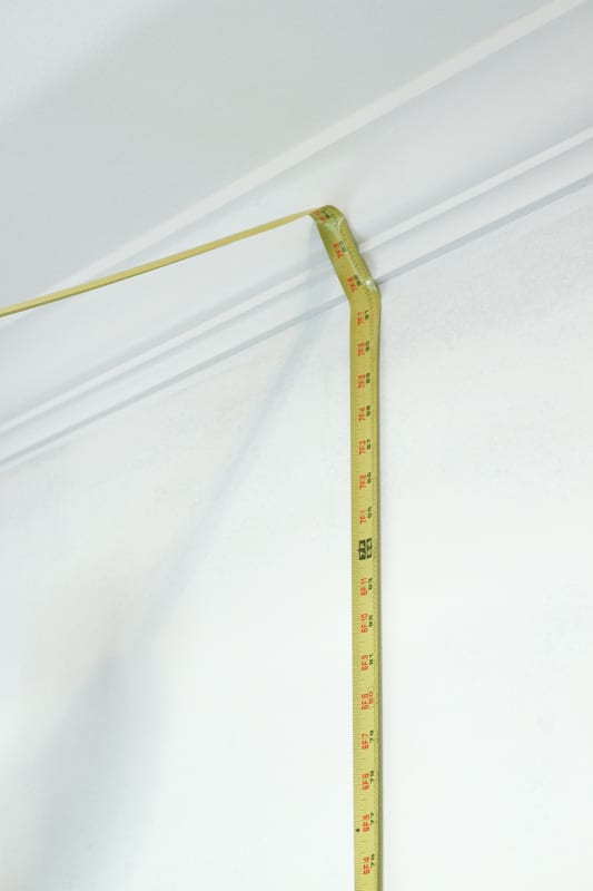Measure the wall twice before cutting the wallpaper.