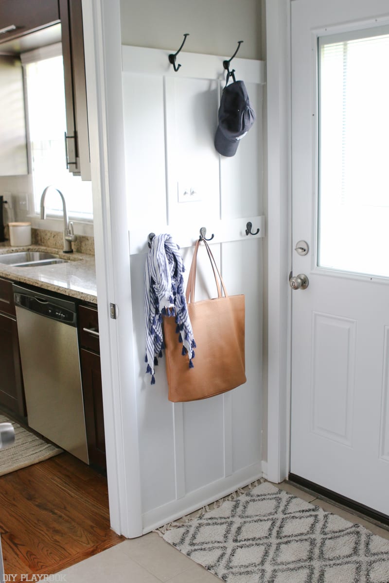 The back door entryway is just as functional as the front! Hooks abound for jackets, purses, scarves and hats. 