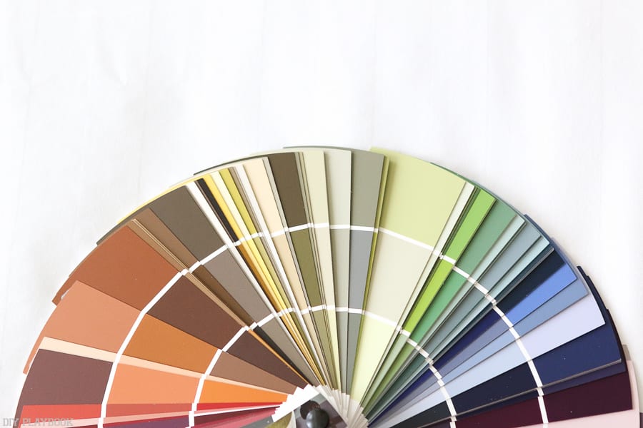 Choosing from an array of paint swatches for this Lowe's fall paint makeover. 