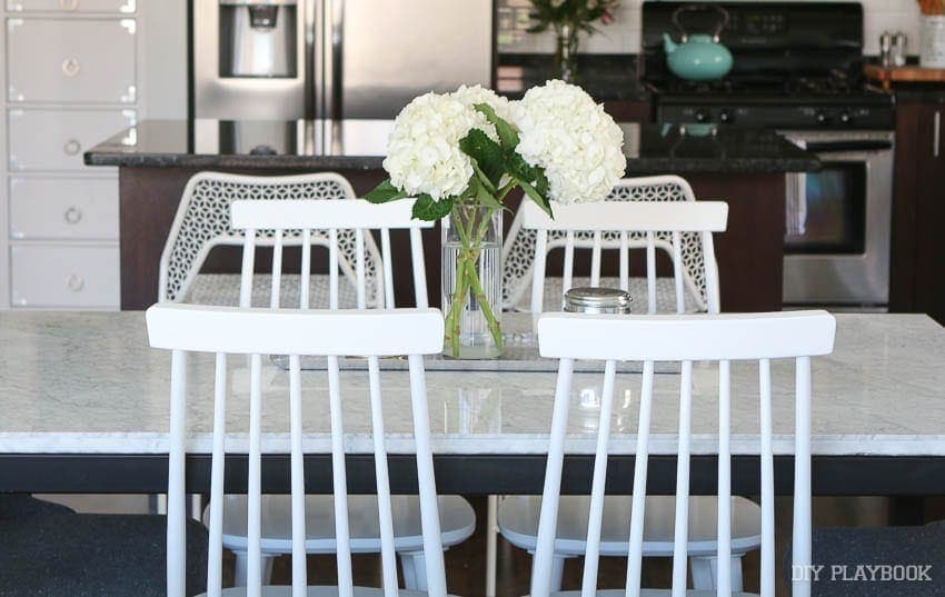 these white chairs were budget-friendly and look great with the rest of the room