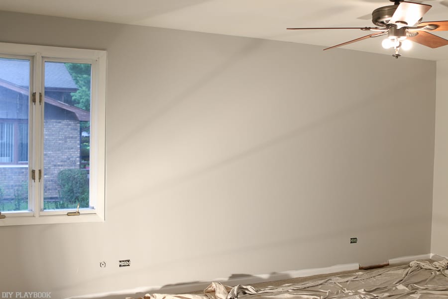 White trim pops against the grey and looks much better than the brown in this bedroom makeover. 