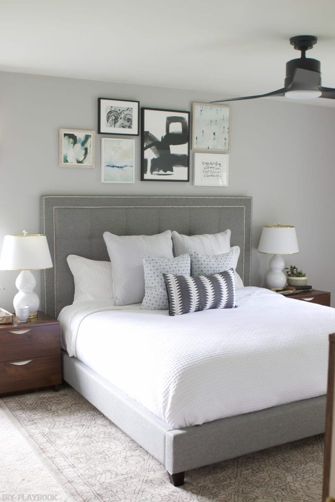 We added a gallery wall above the headboard, with a variety of pieces, and love the finished look