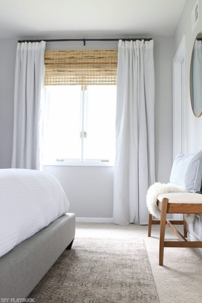 We love how these window treatments add so much light to the bedroom