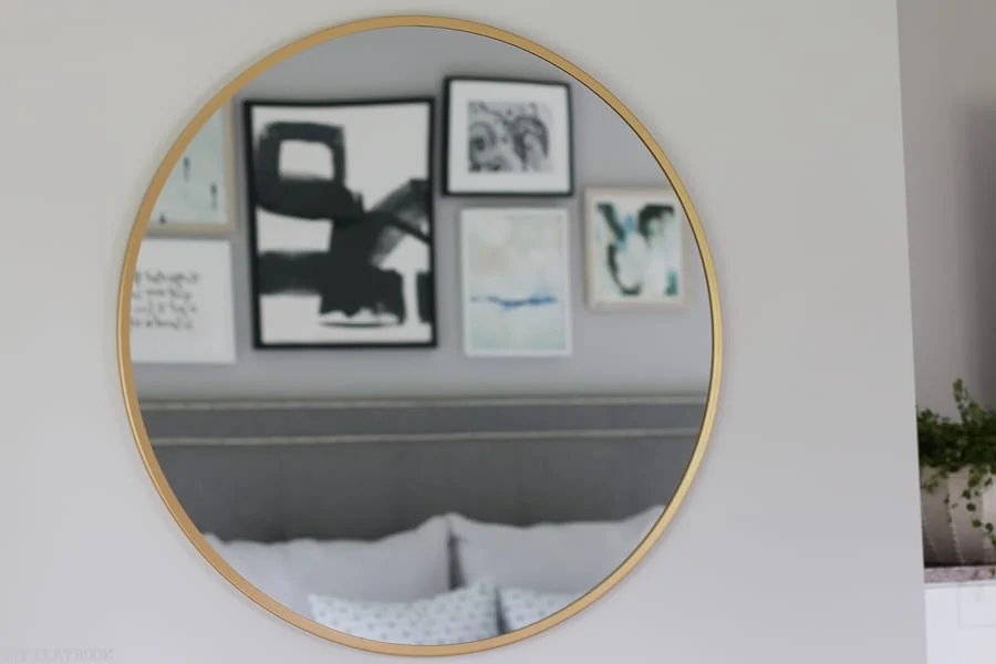 A simple mirror adds the right accent to this wall