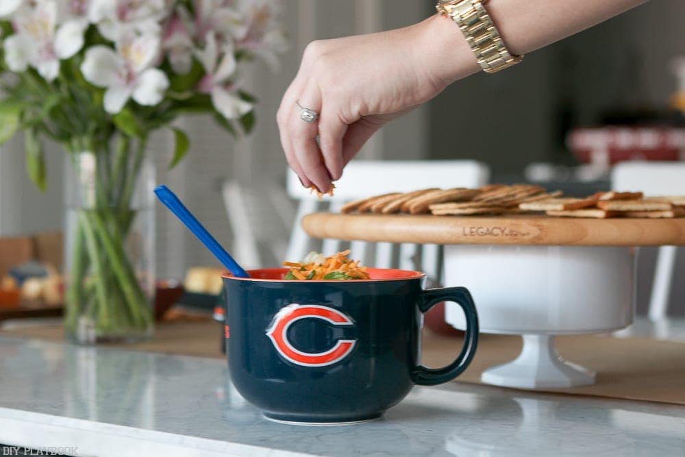 Let your guests add topping that they like to their football chili. Some options are cheese, sour cream and scallions!