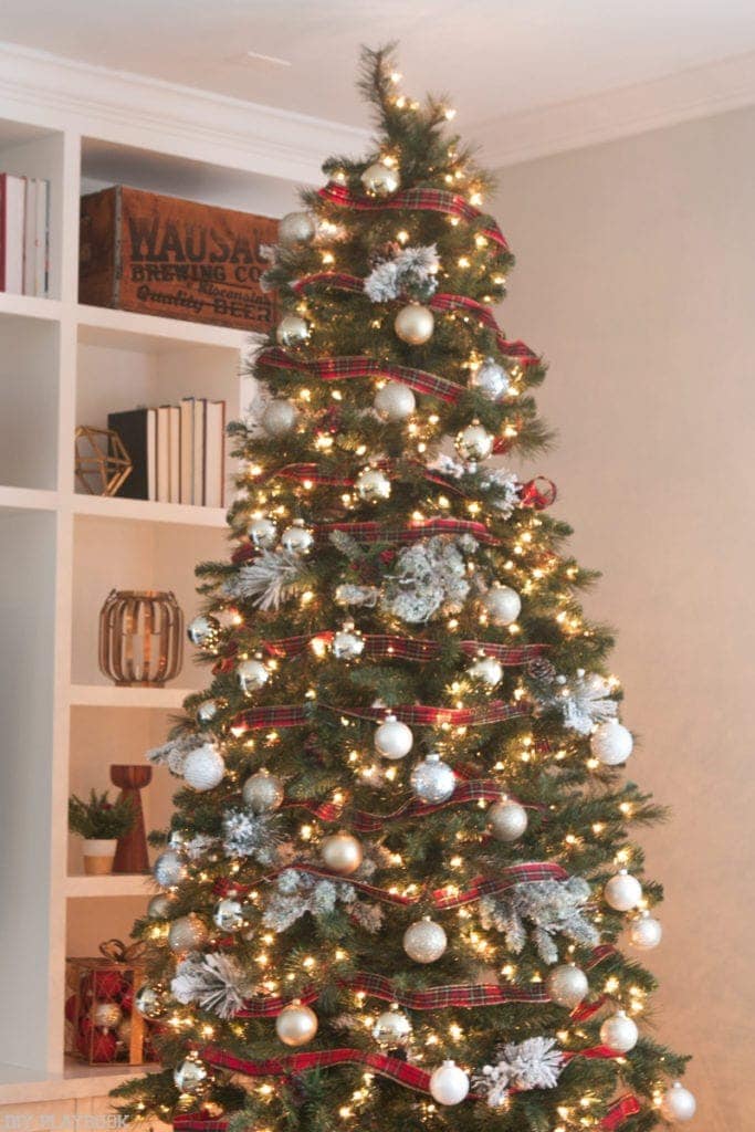 The red really pops against the white, gold and green of this Pretty and Plaid Christmas Tree!