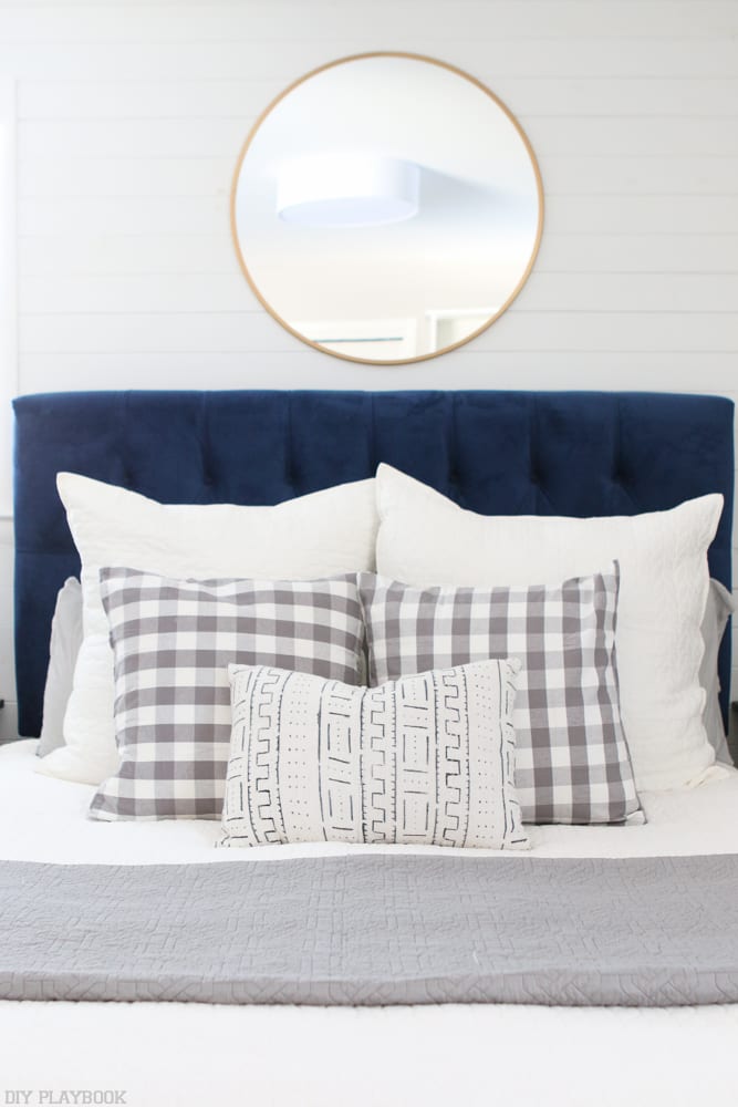 Bridget's bedroom look is classic and modern with a full headboard and unique throw pillow combinations. 